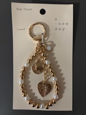 A New Day Gold Bag Charm
